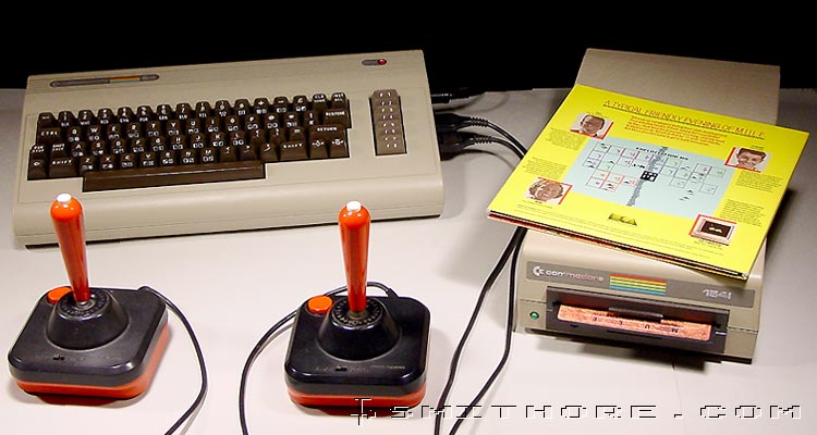 Commodore 64 computer with 1541 diskette drive, 2 wico joysticks and MULE game box